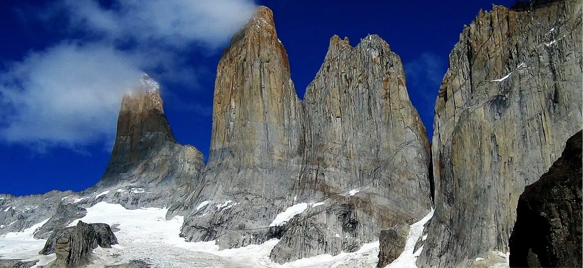 Challenging trekking tour to the green lagoon at the foot of the three granite peaks in Base Torres del Paine.